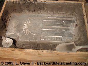 Opening the poured sand mold
